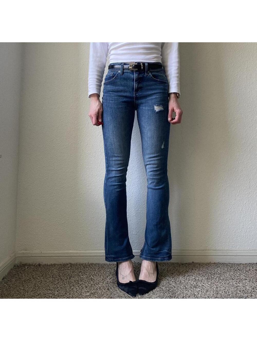 Mid rise bootcut flare dark wash faded and distressed denim blue jeans